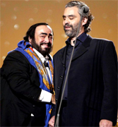 ANDREA BOCELLI AND PAVAROTTI Luciano Pavarotti and his Friends, an organization created to help and support carity organizations around the world, a big concert every summer in Modena Italy with Brian May from Queen, Steve Wonder, George Michael, Zucchero, Laura Pausini, Lady Diana as special guest, The Spice girls, Andrea Bocelli, Bono from U2, Liza Minelli, and an incredible list of international guest coming to help childrens as Luciano's Friends