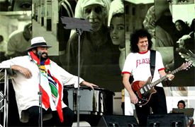 BRIAN MAY AND PAVAROTTI Luciano Pavarotti and his Friends, an organization created to help and support carity organizations around the world, a big concert every summer in Modena Italy with Brian May from Queen, Steve Wonder, George Michael, Zucchero, Laura Pausini, Lady Diana as special guest, The Spice girls, Andrea Bocelli, Bono from U2, Liza Minelli, and an incredible list of international guest coming to help childrens as Luciano's Friends