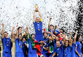 Italy's Fabio Cannavaro lifts the trophy after defeating France 5-3 in a shootout in the final of the soccer World Cup between Italy and France... CAMPIONI DEL MONDO, CAMPIONI DEL MONDO, CAMPIONI DEL MONDO, CAMPIONI DEL MONDO